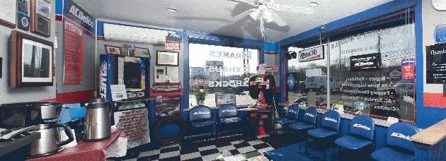 Technician performing diagnostics on a vehicle