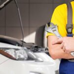 Mechanic Working On Car Engine