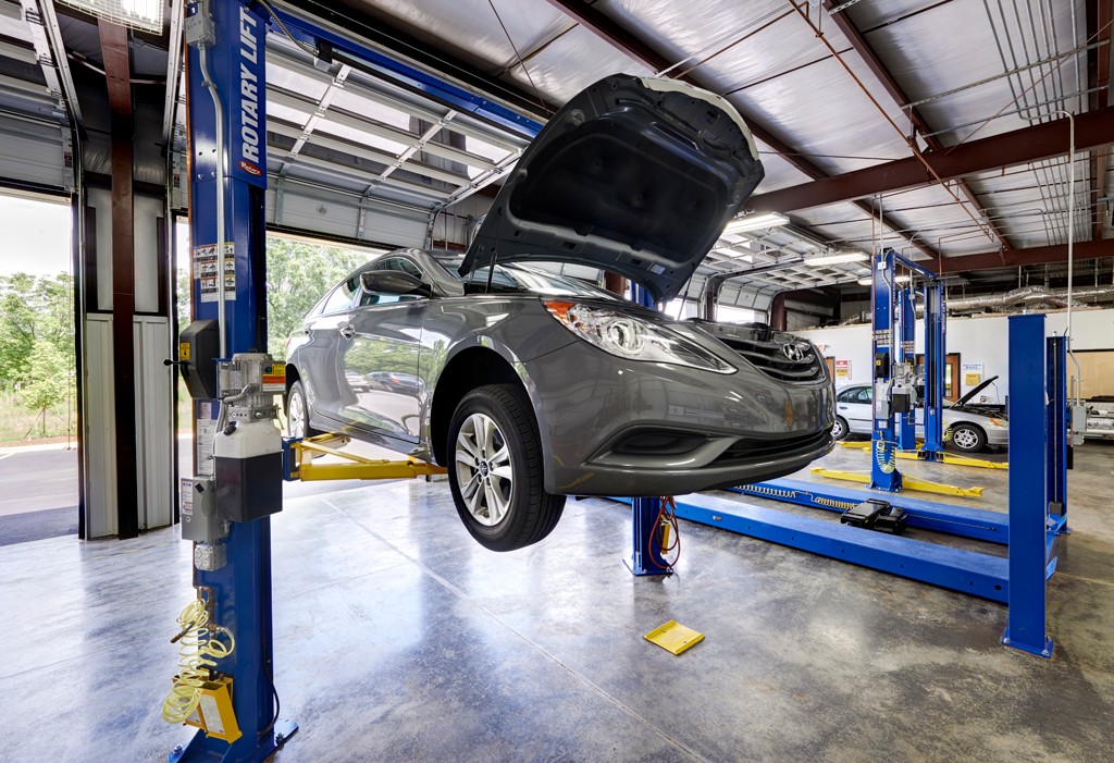 Mechanic Working on Car Engine