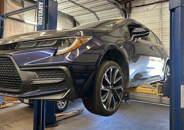 Mechanic checking brake pads