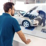 Mechanic examining a car engine