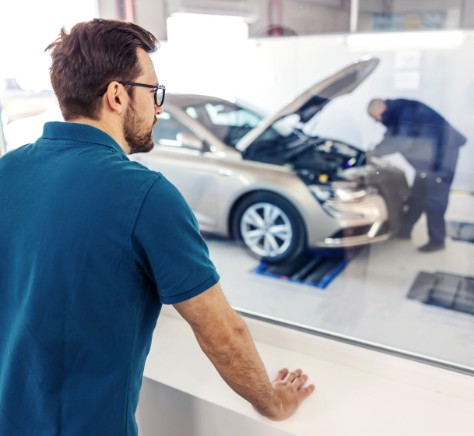 Mechanic examining a car engine