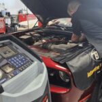 Technician working on car AC