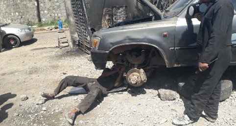 Auto Repair Technician Working on Engine
