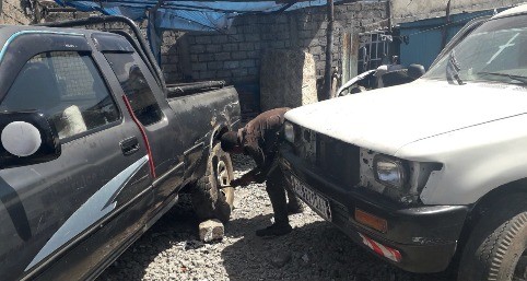 Vehicle Repair Worker Tightening Wheels