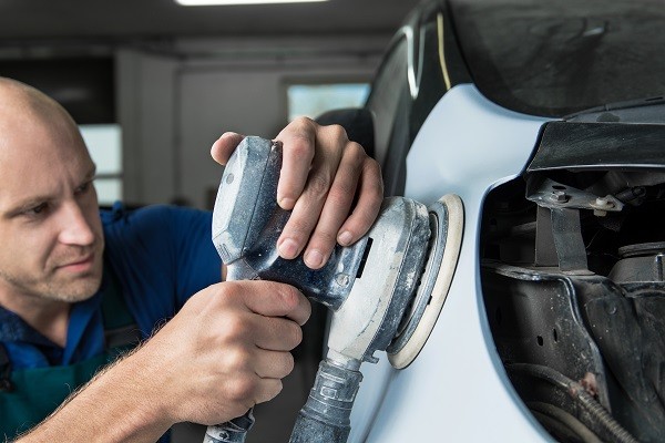 Car frame straightening process in an auto repair shop