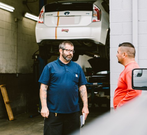 Mechanic Talking to Customer