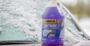 Rain X deicer on hood in front of iced over windshield
